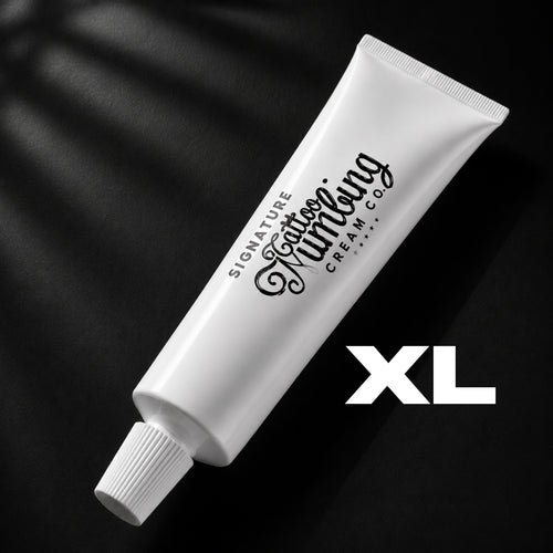 Signature 30g XL tattoo numbing cream in a tattoo studio